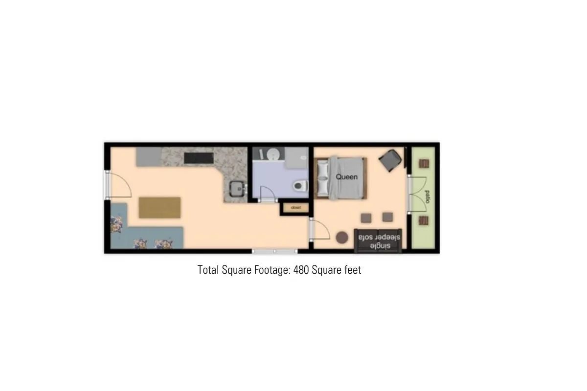 The image captures a bright, inviting interior with a queen bed, a living area featuring a plush sofa, and a kitchenette in the background. The open layout highlights how the living space is both comfortable and practical, catering to relaxation and light entertaining.